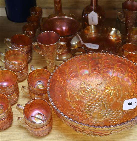 A pair of Carnival glass crucifix candlesticks and a collection of other marigold Carnival glass,